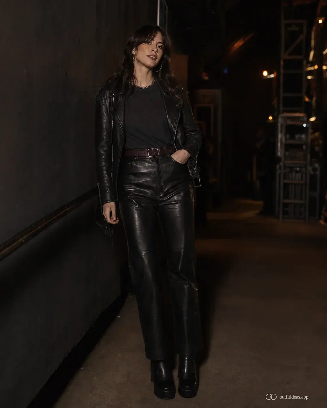 Rock concert outfit with a tucked band tee, leather trouser, leather jacket and block boot